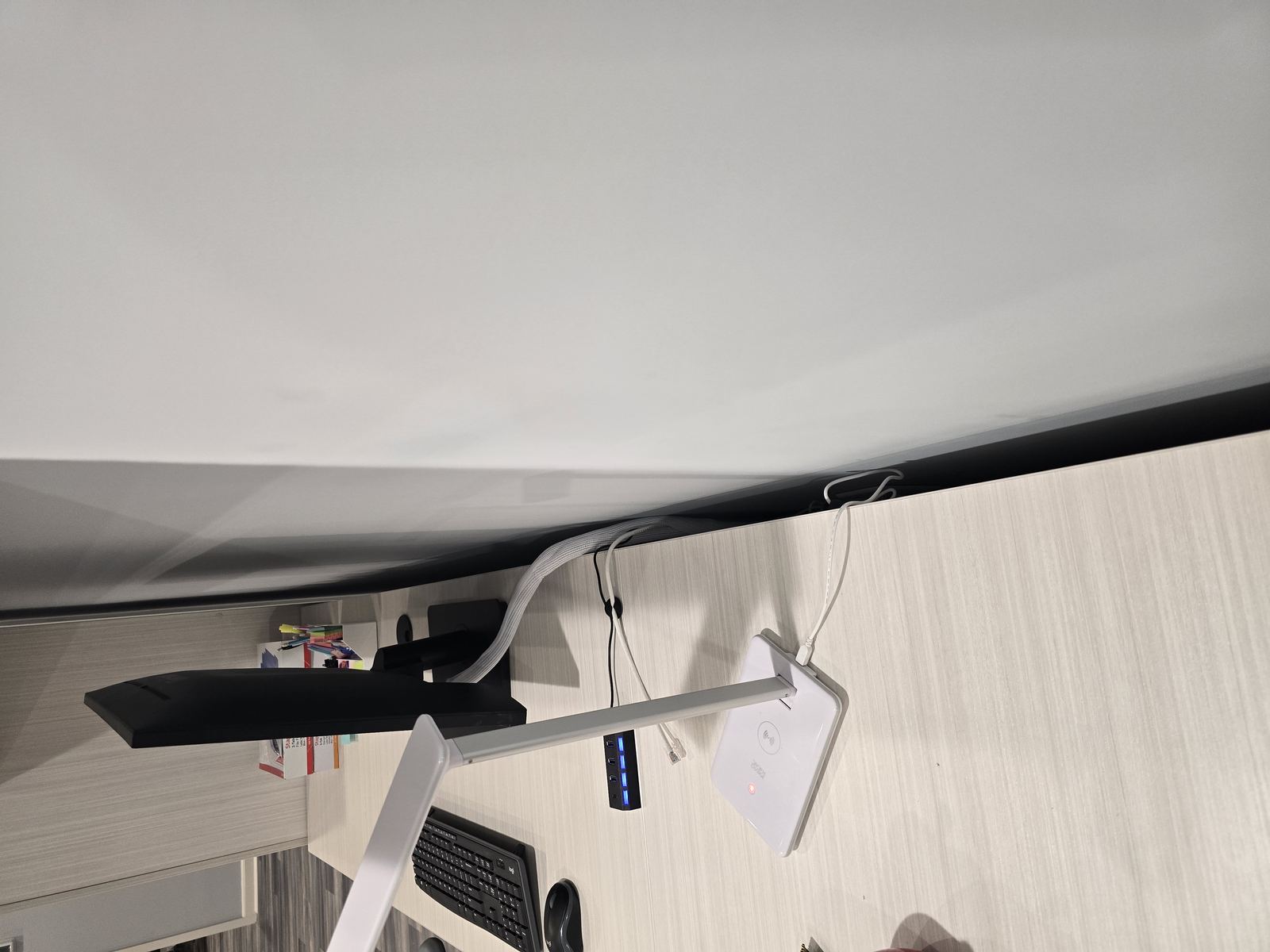 Desk lamp and USB hub setup at workstation