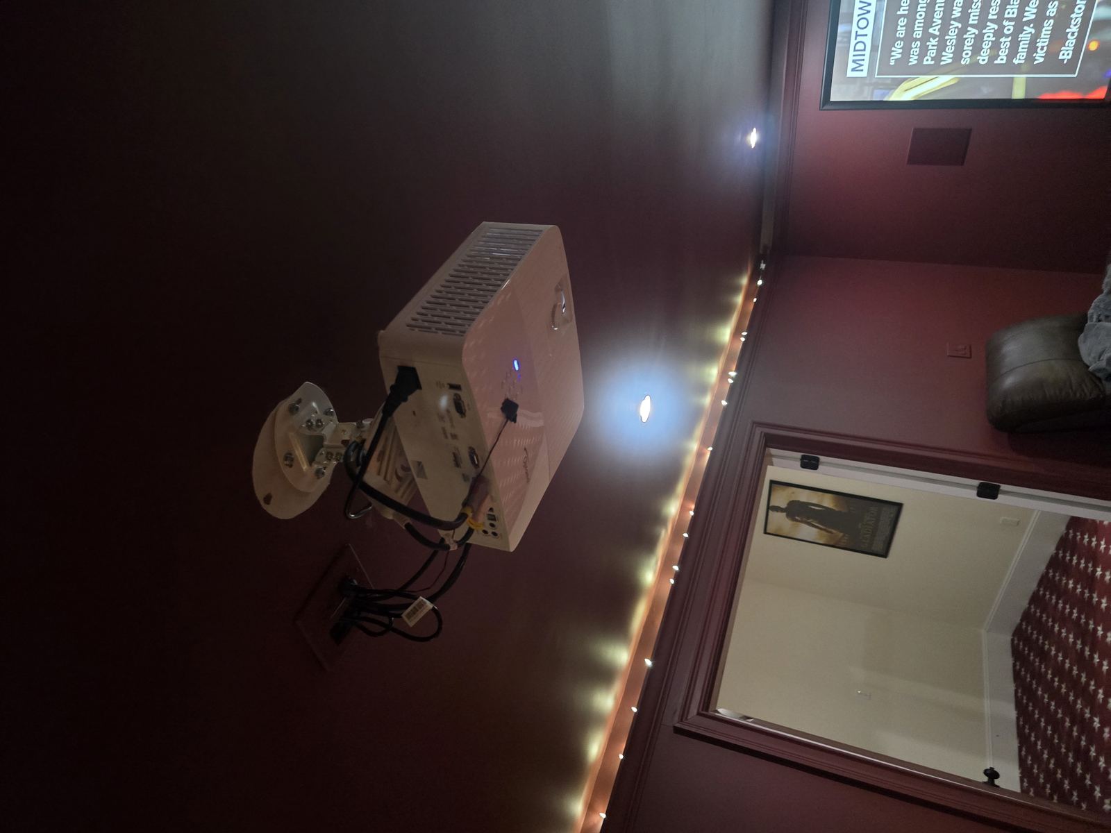 Home theater projector with screen showing content