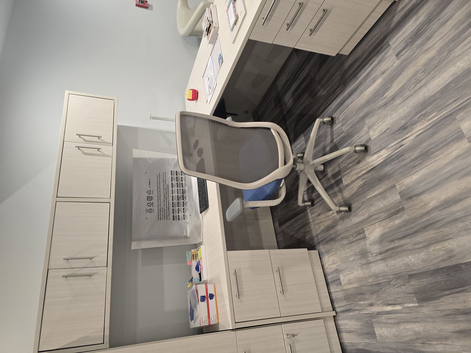 Office workstation with cabinetry and desk chair